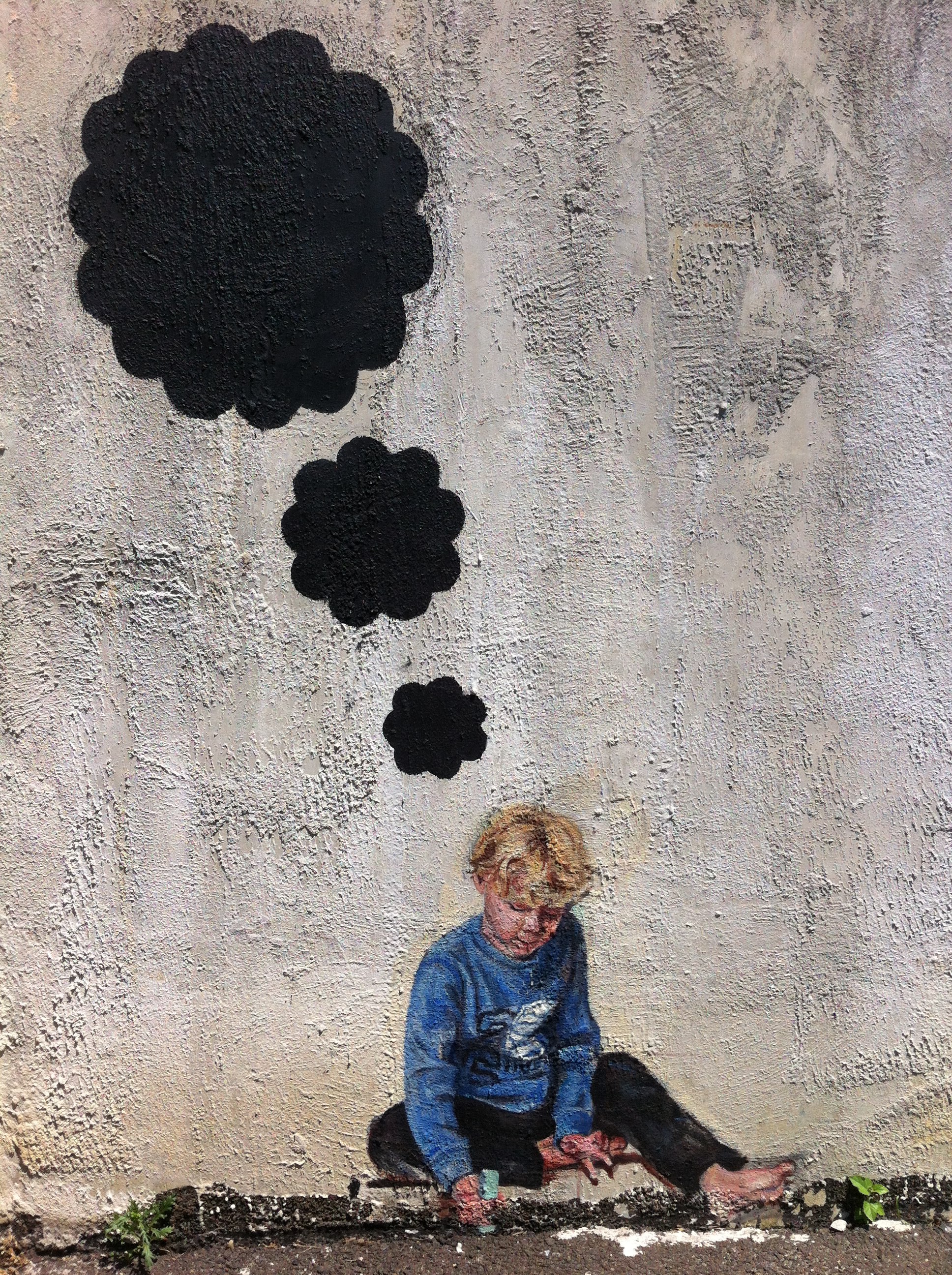 Mia Massimino's mural is located outside the Takoma Park Community Center.  Local Residents are encouraged to use chalk to fill in the boy's thought bubbles.