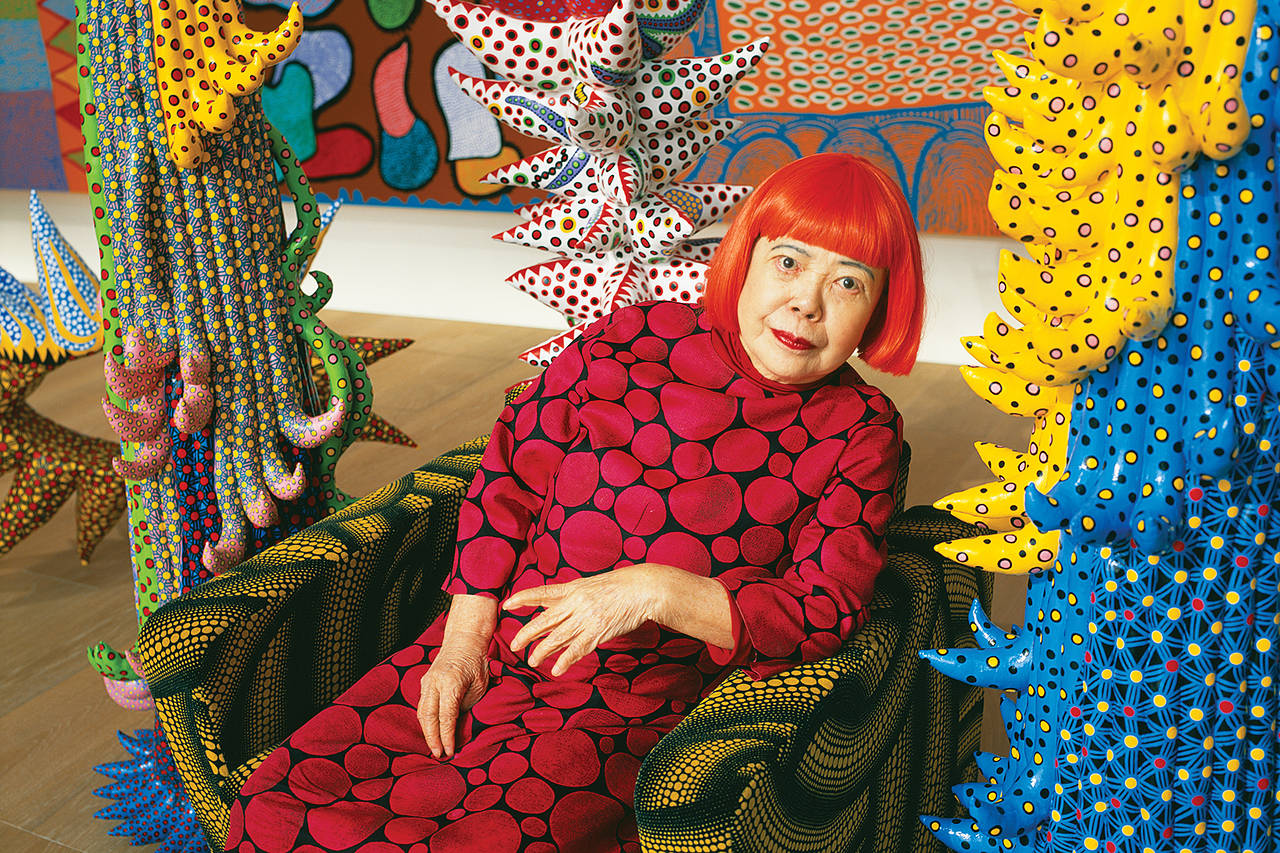 Giant Yayoi Kusama doll on the façade of the