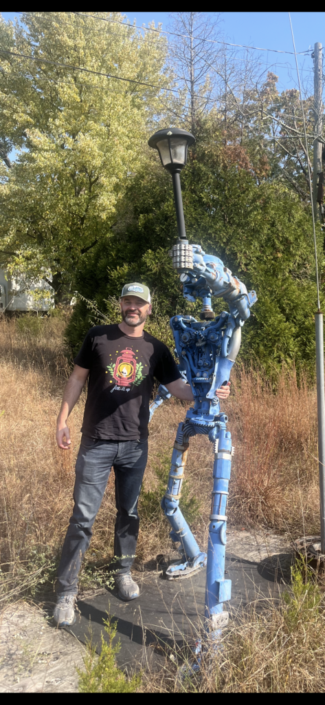 Theodore Carter in front of William Clark's musical robot in Bueno, New Jersey.